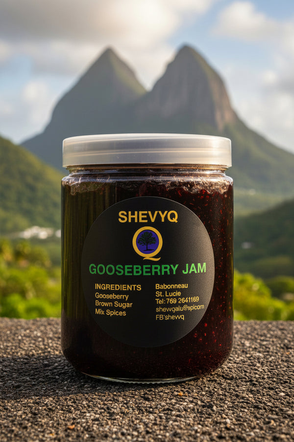 A jar of Shevyq Gooseberry Jam placed on a textured surface with a blurred mountain landscape in the background. The jar has a white lid and a black label with green and gold text.