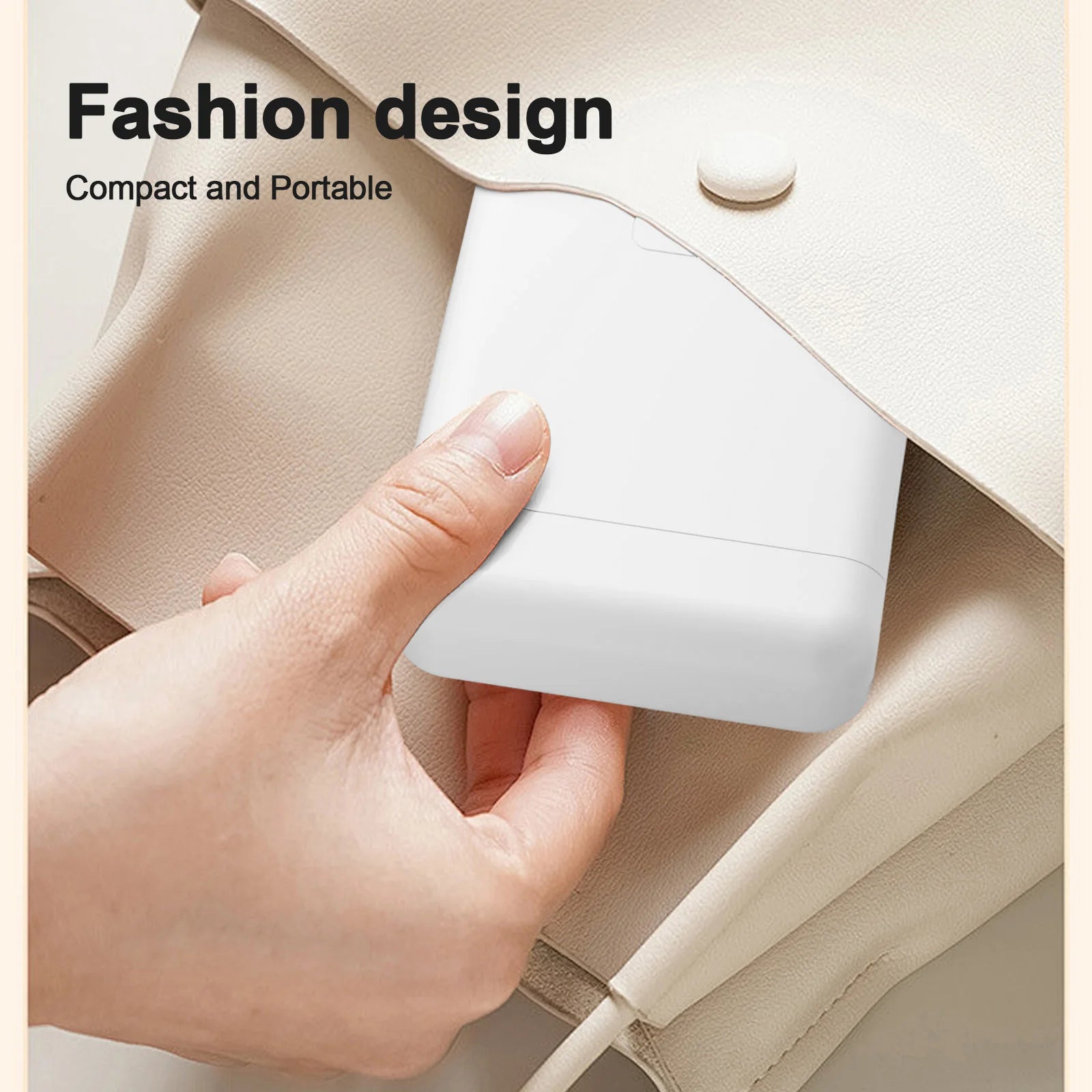 Hand holding a white electronic device against a beige background with text 'Fashion design' and 'Compact and Portable'.