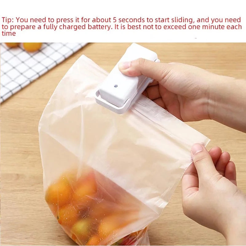 Person using a Heat Sealing Machine Portable Bag Sealer for Home & Kitchen to seal a plastic bag.
